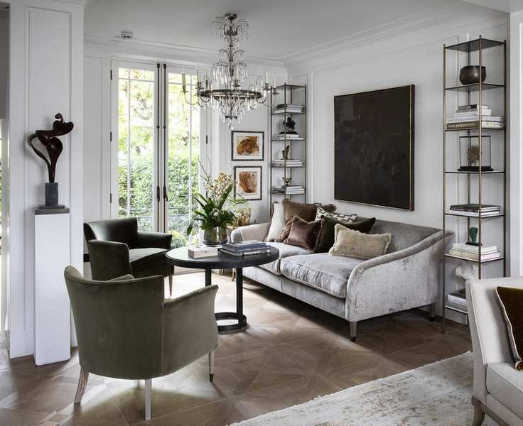 Contemporary white room with a traditional candle chandelier