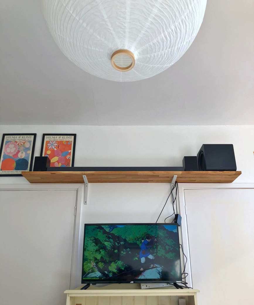 Samsung HW-QS750F soundbar in action with a TV show on screen.
