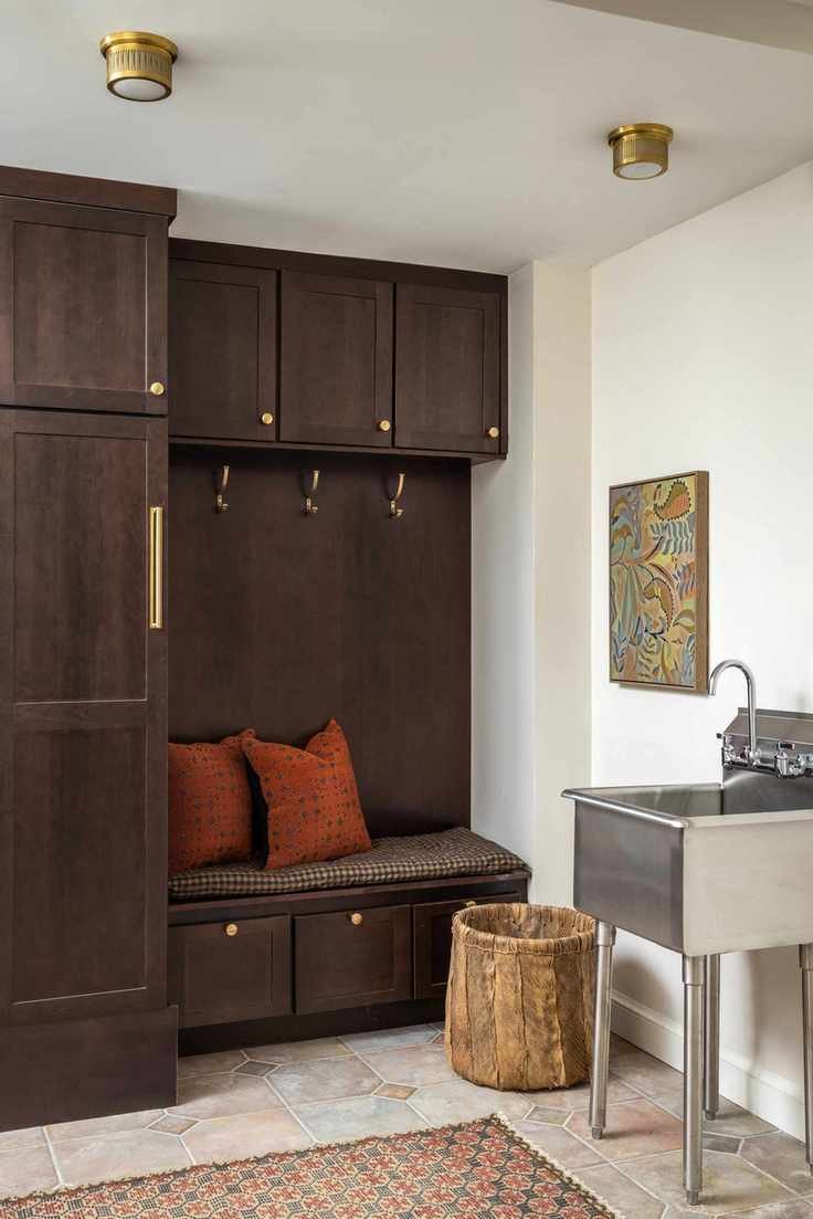 mudroom with stainless steel sink on legs