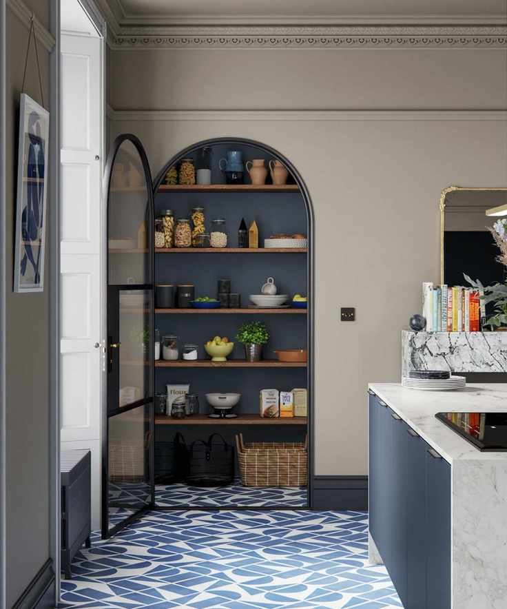 Modern kitchen with arch doorway leading to pantry, kitchen island