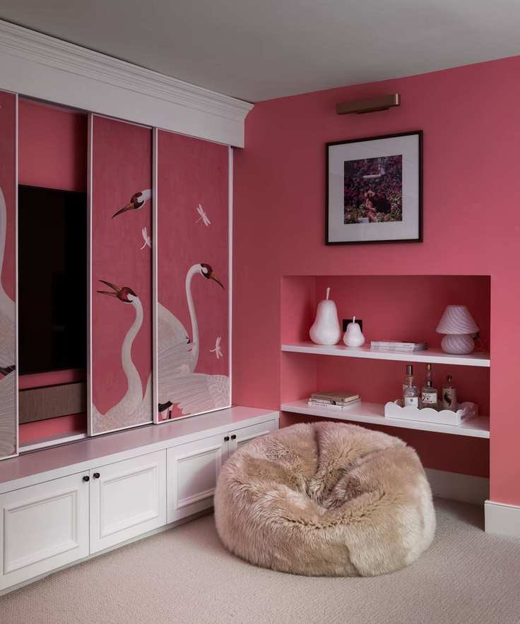 Living room with dark pink paint and bespoke sliding screen with mural