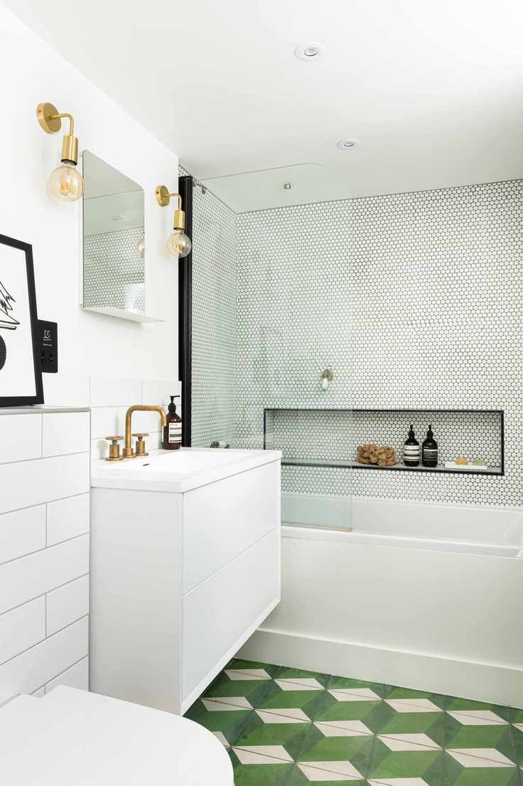 Bathroom with a shower niche for storage.