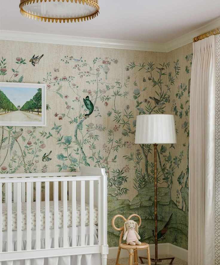 vintage lighting in a wallpapered baby nursery