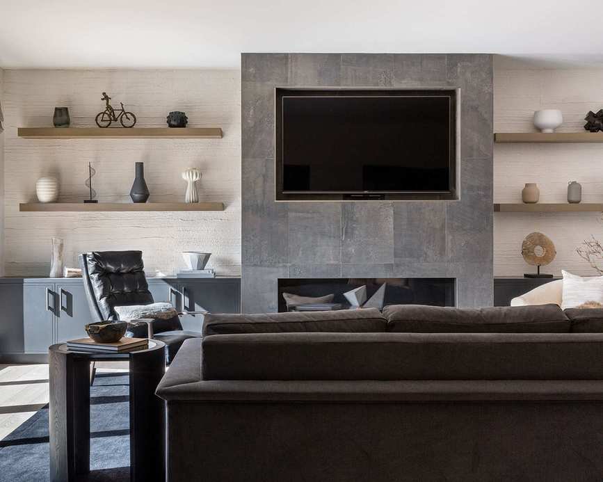 Living room with TV and grey wall and sofa