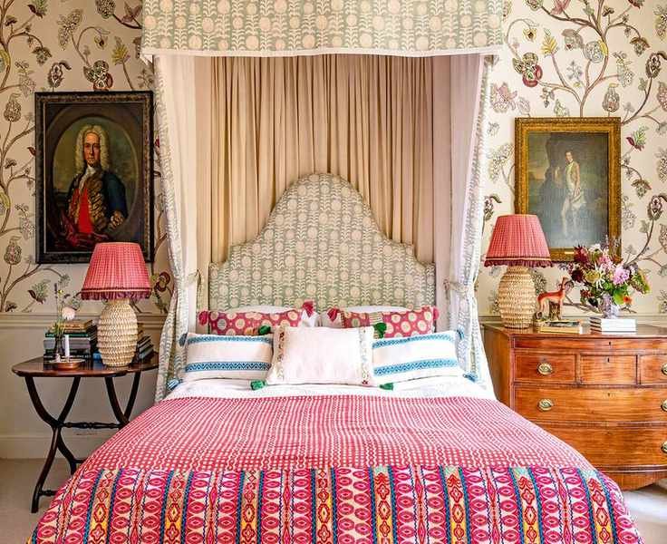 Bedroom with patterned fabrics and wallpaper