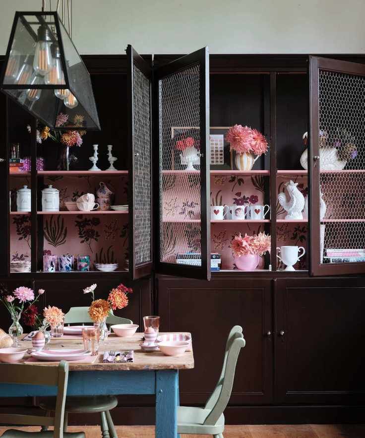 dining room kitchen with large custom cabinets with wallpaper interior