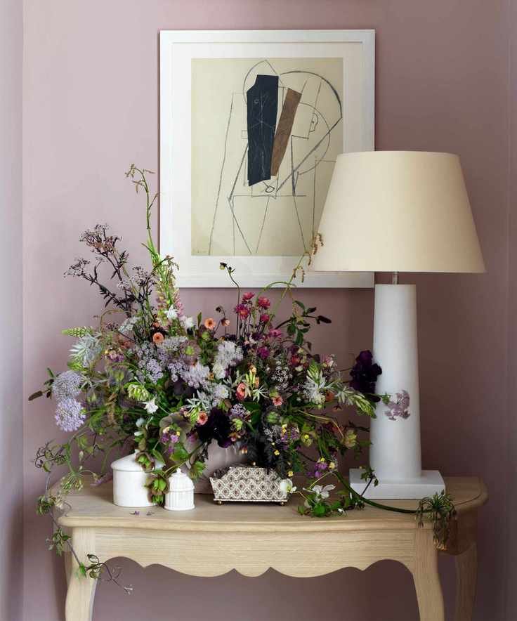 Flowers in lilac hallway on table