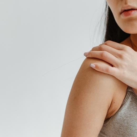 Woman turned to the side showing her arm and smooth skin Woman turned to the side showing her arm and smooth skin