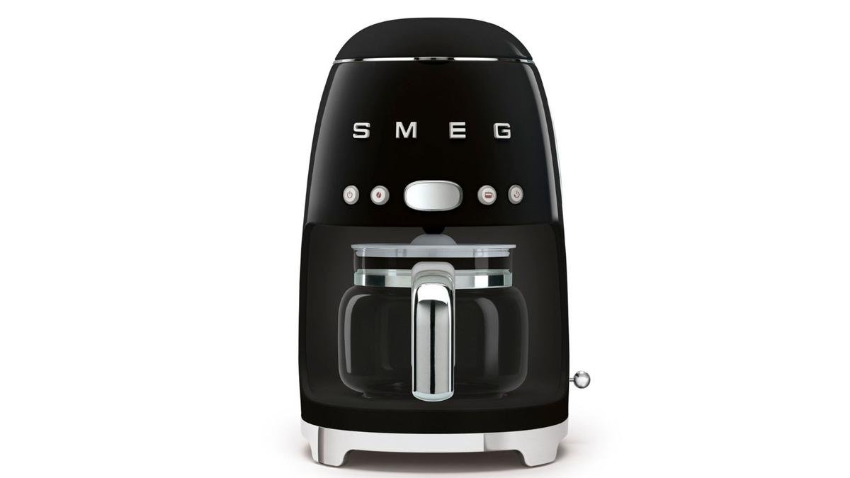 A black smeg drip coffee maker on a white background