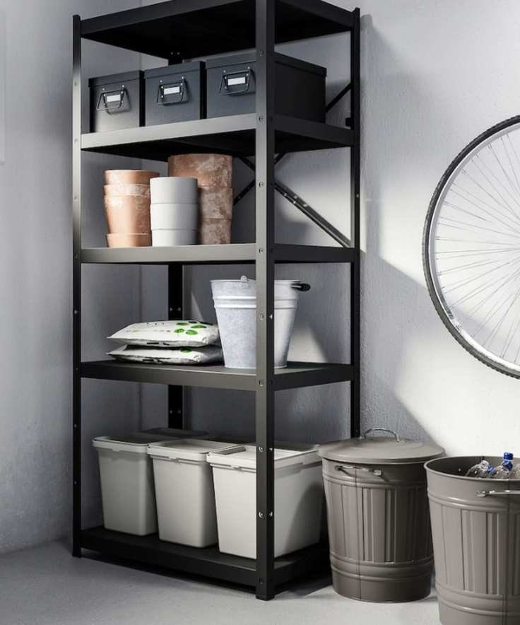 ikea shelving unit and storage bins with terracotta pots