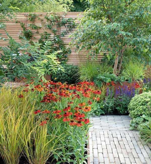 brick pathway through flower beds