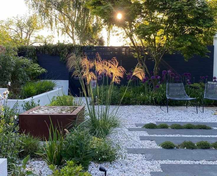 small garden with planting and water feature