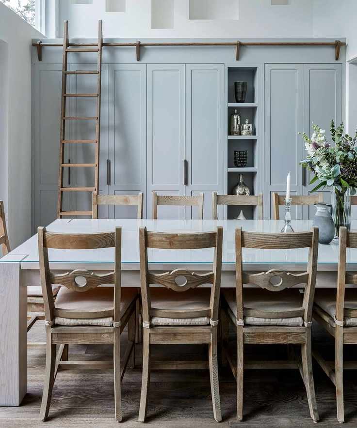 family kitchen with tall hidden storage and wood table and chairs