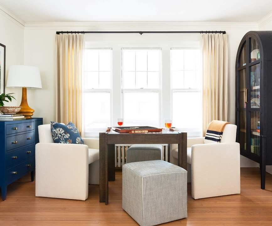 game room with navy chest of drawers by Camden Grace Interiors