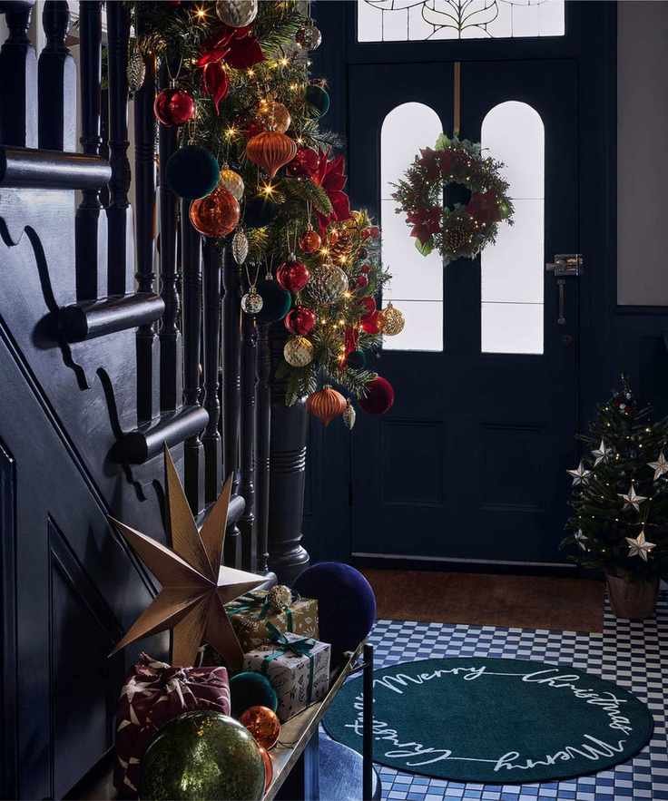 Black staircase and front door, tiled floor