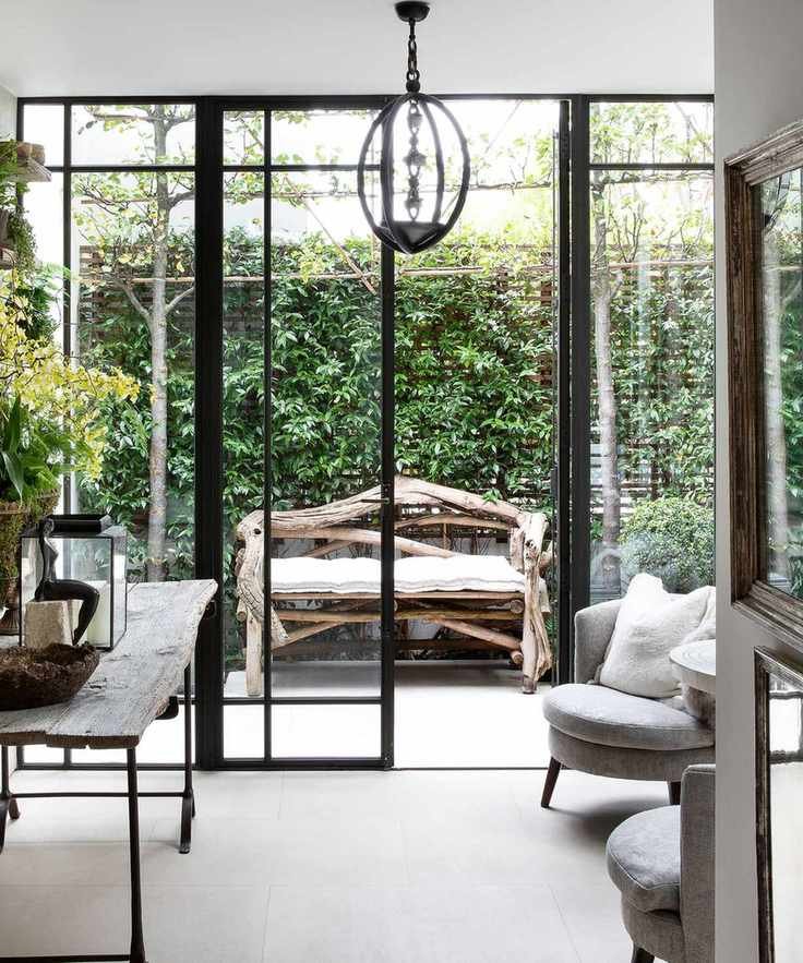 Courtyard garden ideas using the same flooring as inside