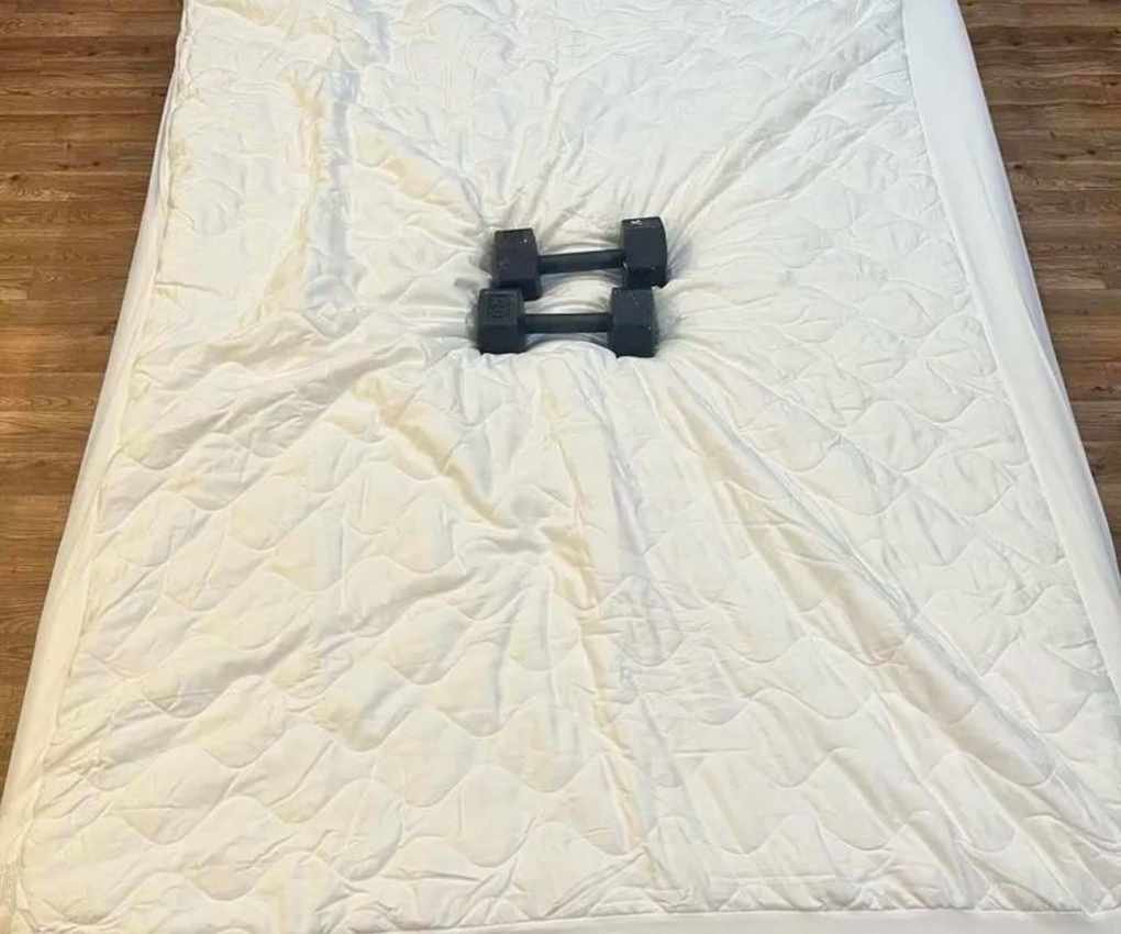 Weights on a Nectar Memory Foam mattress.