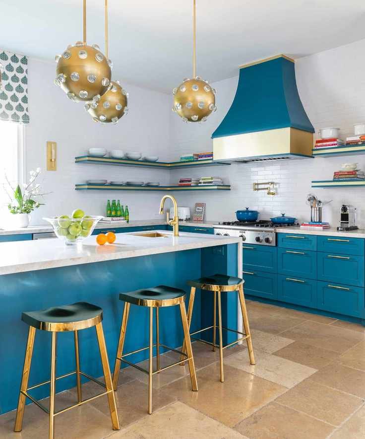 Teal blue and white kitchen with metallic brass fixtures