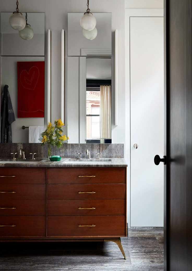 Stained wood sink drawers, twin sinks and mirrors