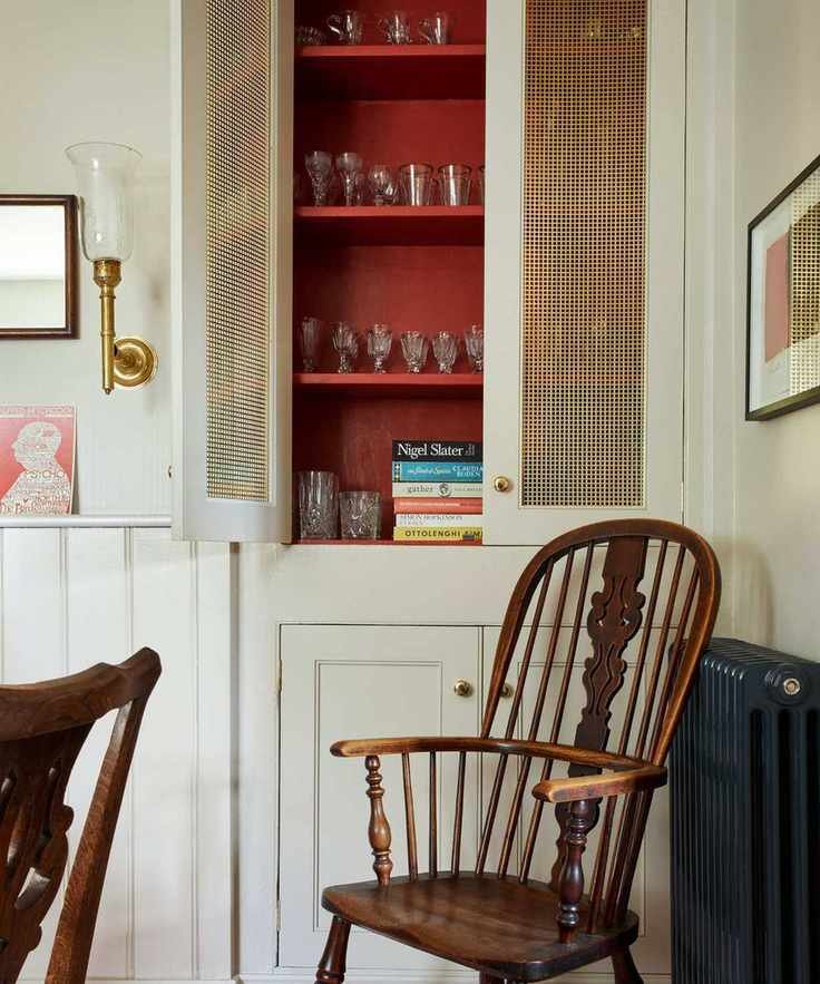 White cupboard with inside painted red