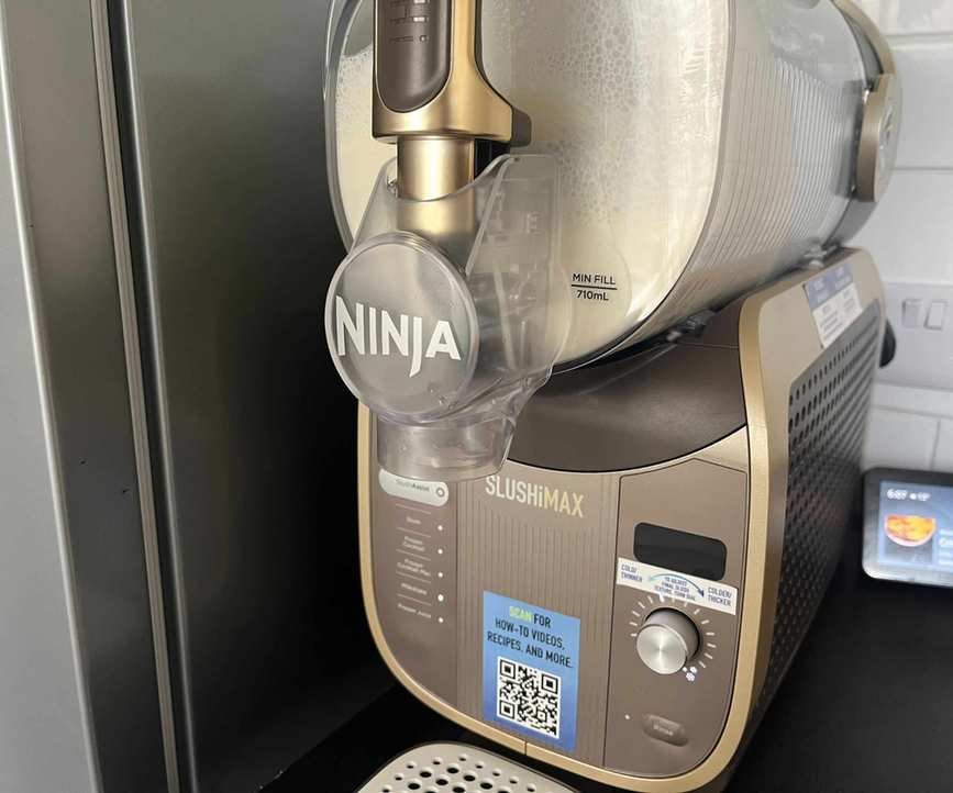 Milkshake mixture being mixed in the Ninja SLUSHi Max.