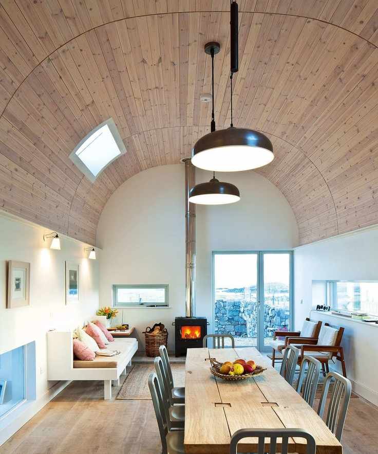 Stylish living and dining space with a barrel vaulted ceiling and modern furnishings