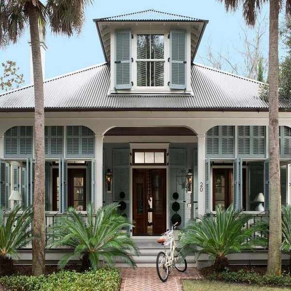 exterior of colonial style home with porch and blue shutters