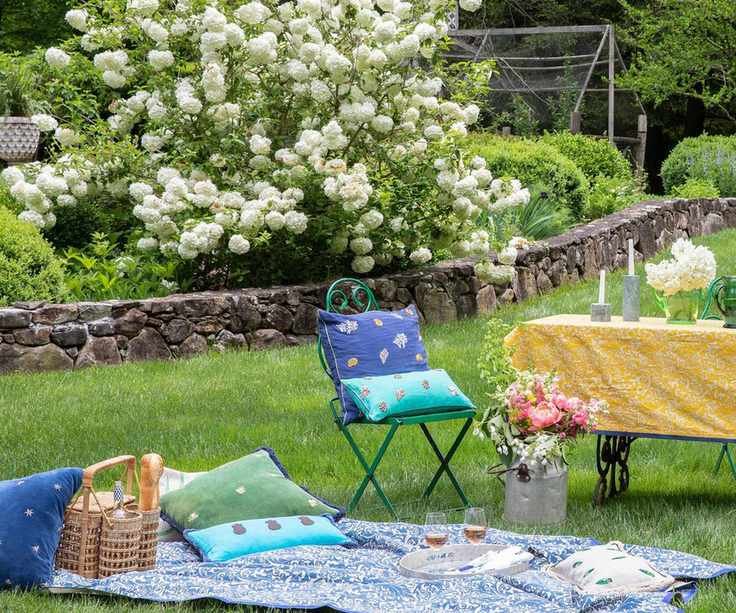 Picnic on a lawn with a bottle carrier and tray