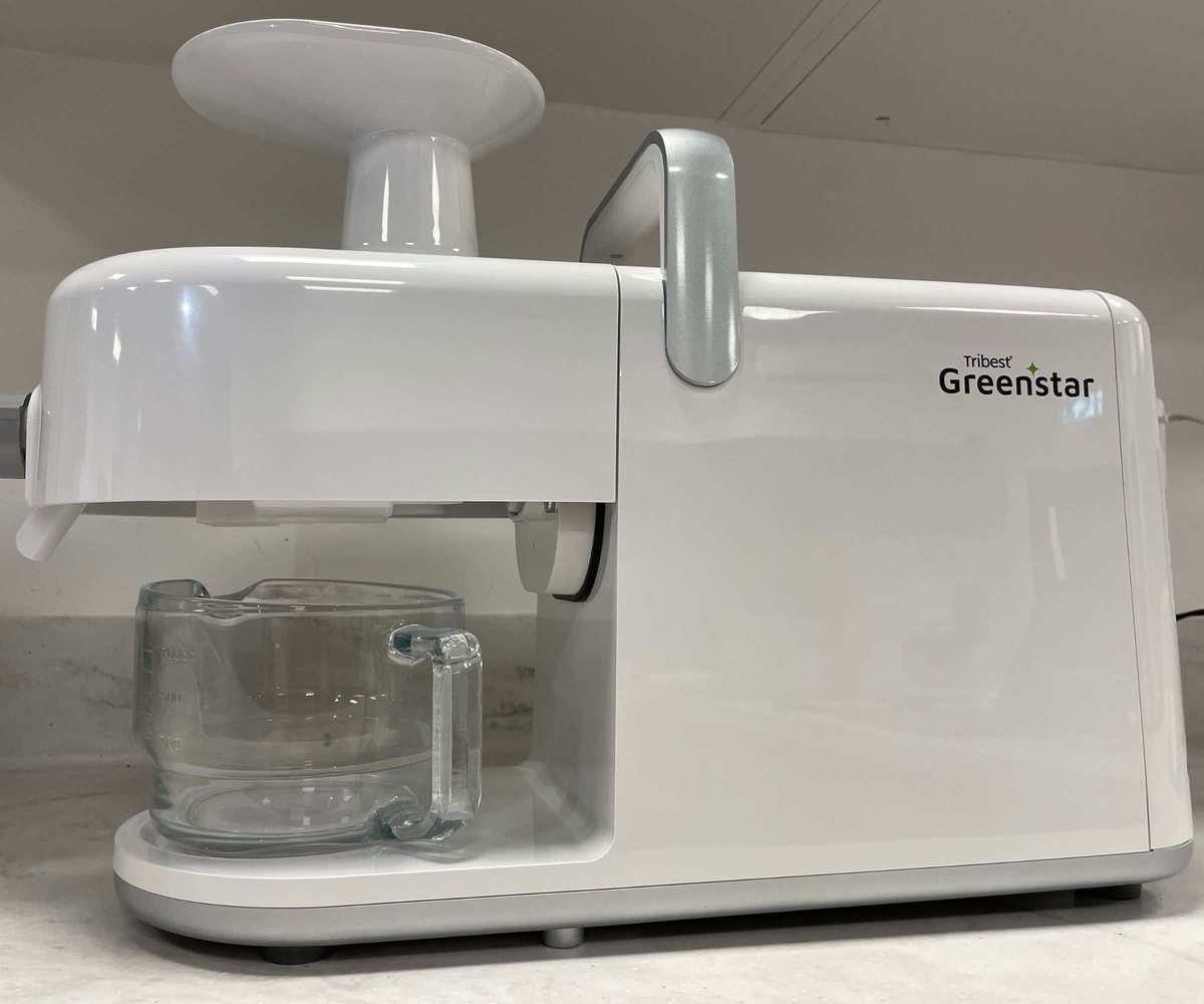 Tribest GreenStar 5 Juicer - a white plastic juicer with a horizontal design, on the countertop.