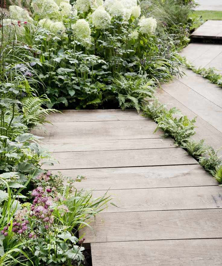 Permeable decking with gaps in between for planting and drainage
