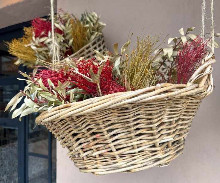 Dried floral arrangement in hanging basket