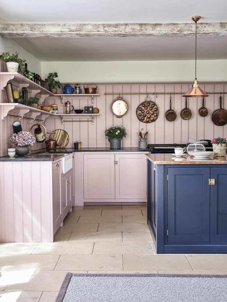 Pink country kitchen with navy blue island