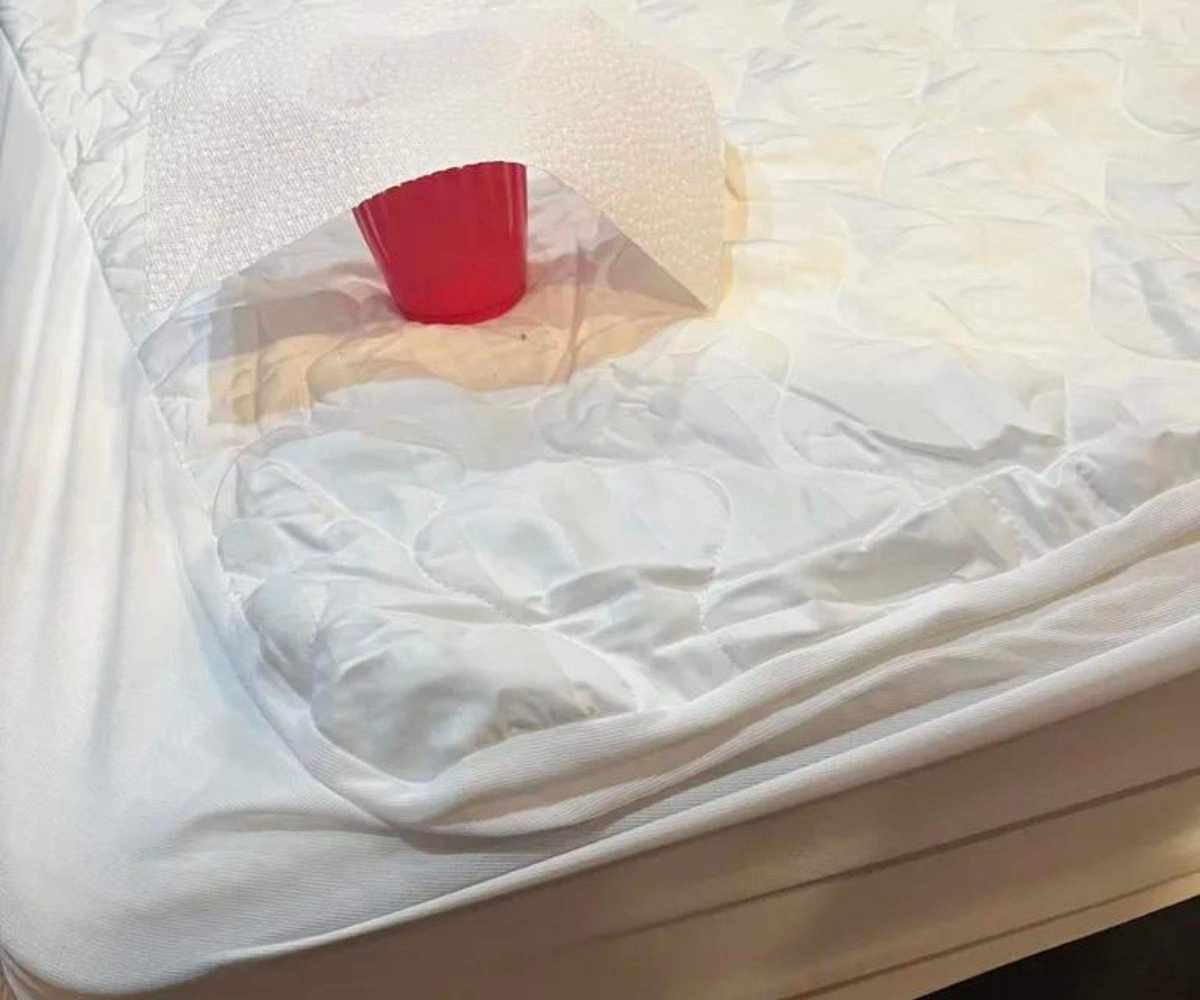 A cup of water on a Nectar Memory Foam mattress.
