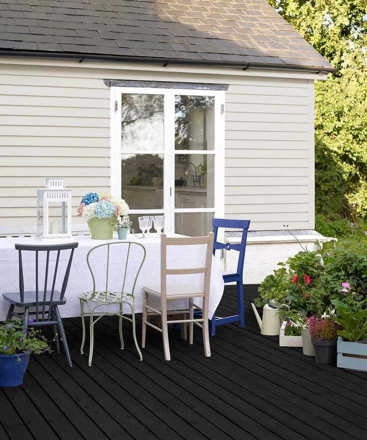 Sadolin painted black deck with dining furniture