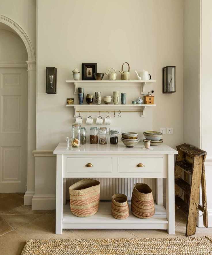 Free-standing coffee bar with open storage and hooks for hanging mugs