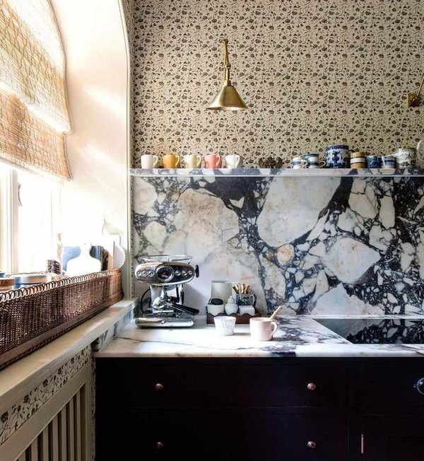 floral wallpapered kitchen with a dark viola marble countertop