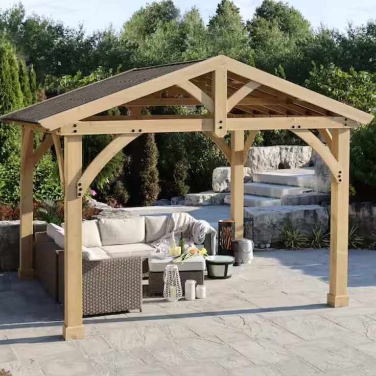 Wooden framed gazebo over outdoor furniture