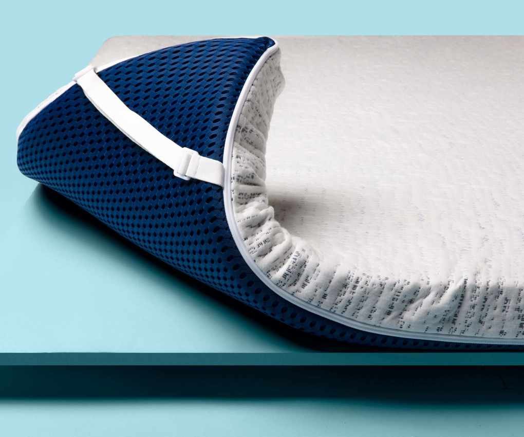 Viscosoft high density mattress topper folded at the corner showing strap