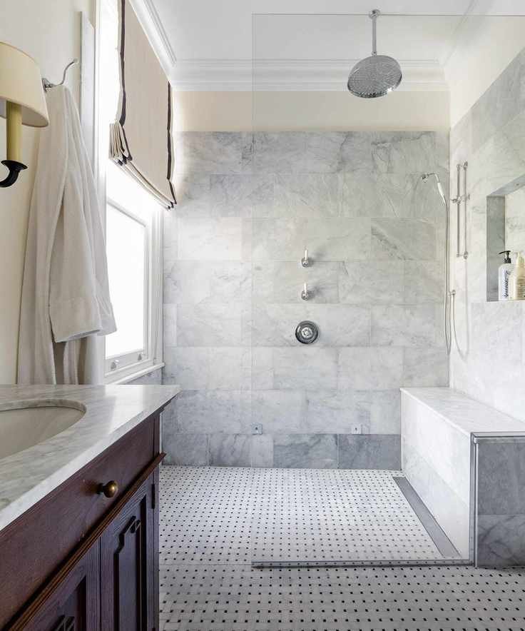 Frameless glass shower screen in a wet room.