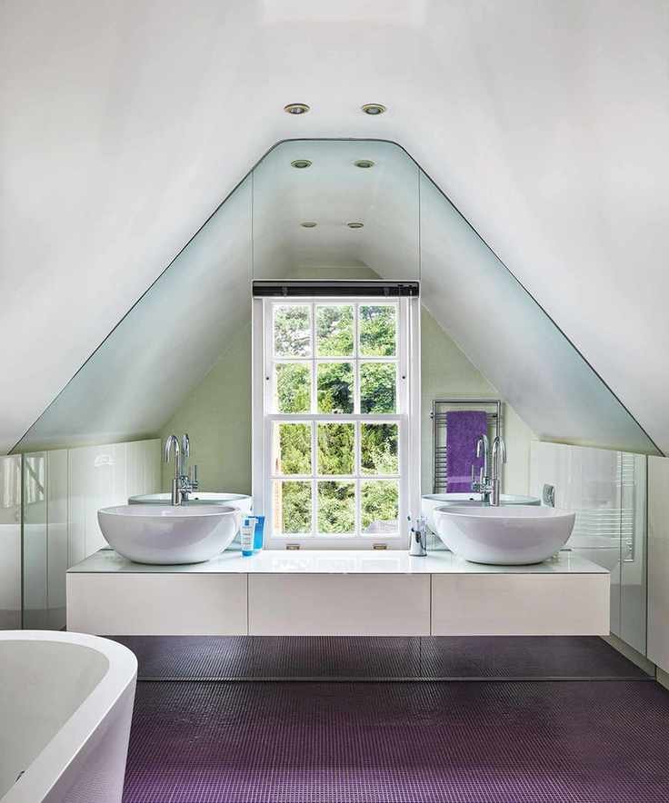Child's bathroom featuring a pitched ceiling and modern design elements