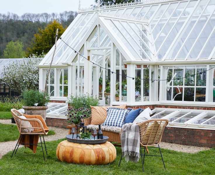 large greenhouse with seating area