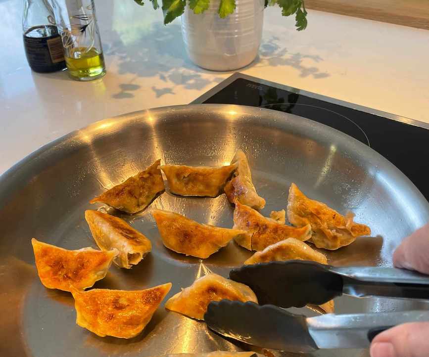 MadeIn 10 inch Stainless Clad Frying Pan sizzling gyozas