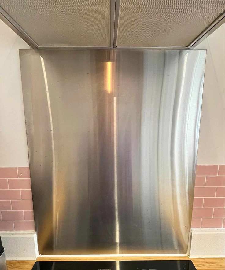 My stainless steel backsplash after cleaning it with my essential oil cleaning spray. It is spotless and has no streaks