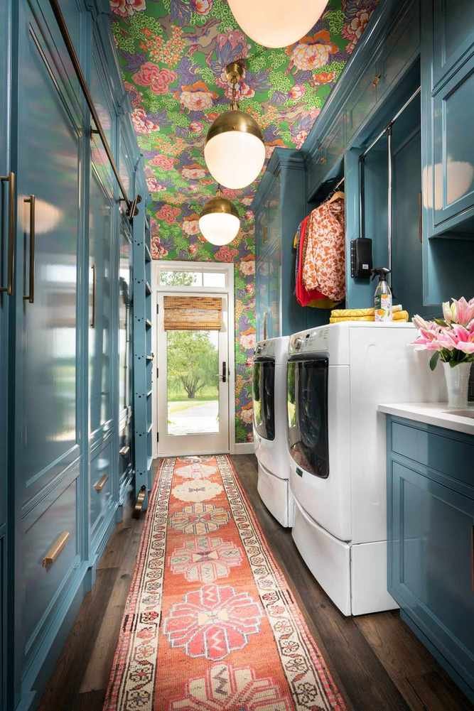 Vibrant laundry room with glossy blue cabinets