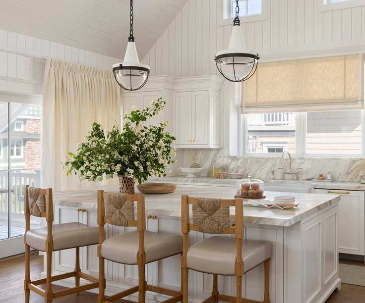 white shaker kitchen with large doors and windows