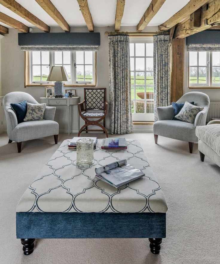 Living room with cream carpet and walls