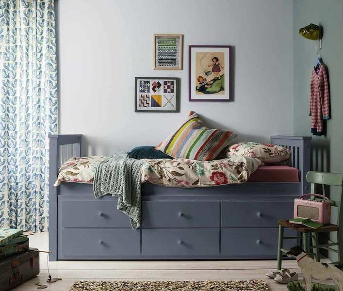 kids' room with gray day bed with storage, green and blue walls