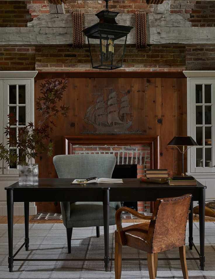 Nautical-themed workspace with brick accents and dark wood