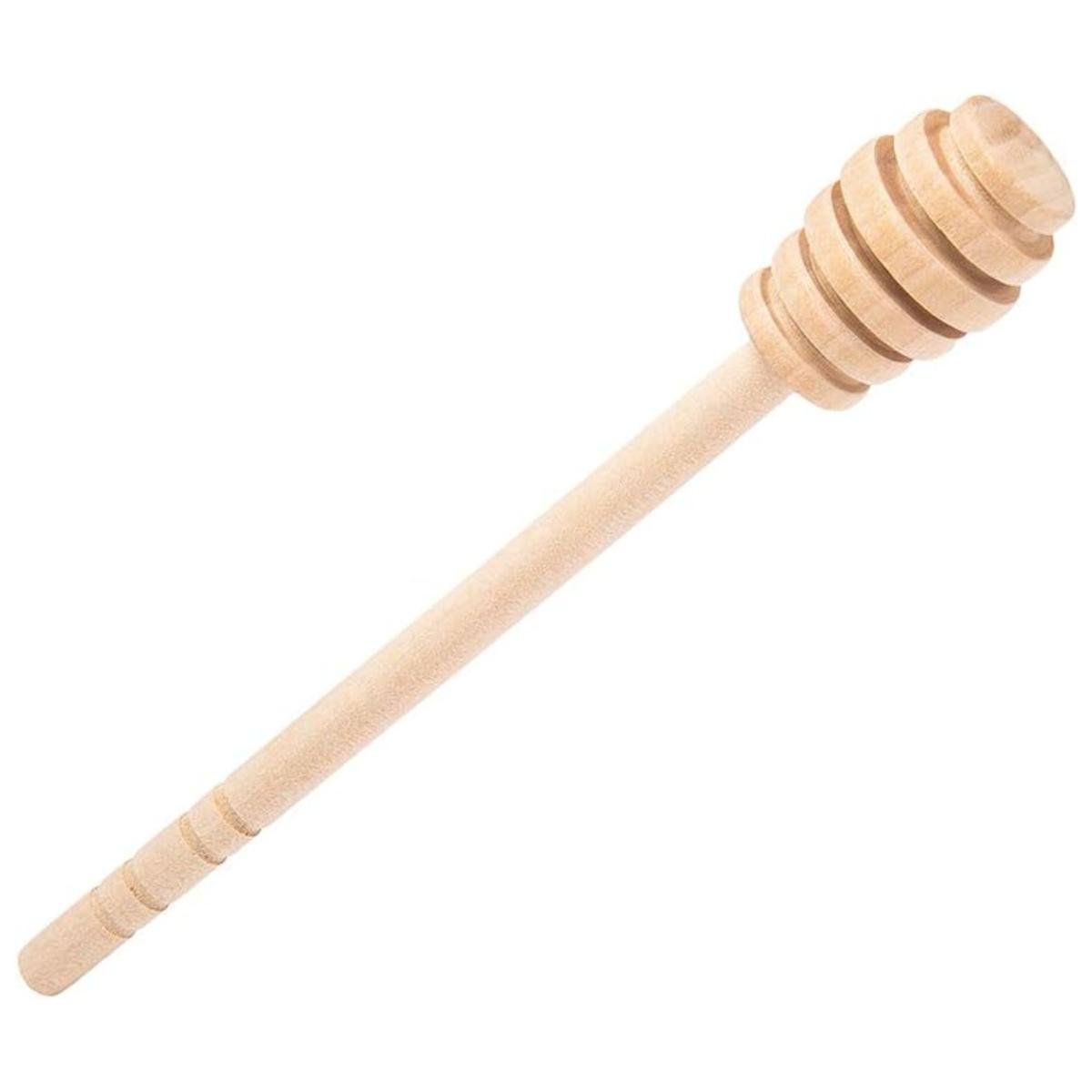 A wooden honey stirrer stick