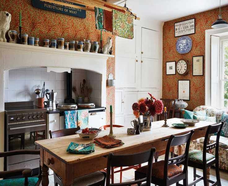 William Morris wallpaper with farmhouse table and white cabinetry